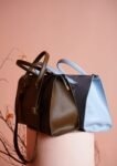 Chic designer handbags displayed in an elegant studio setup, highlighting modern fashion accessories.
